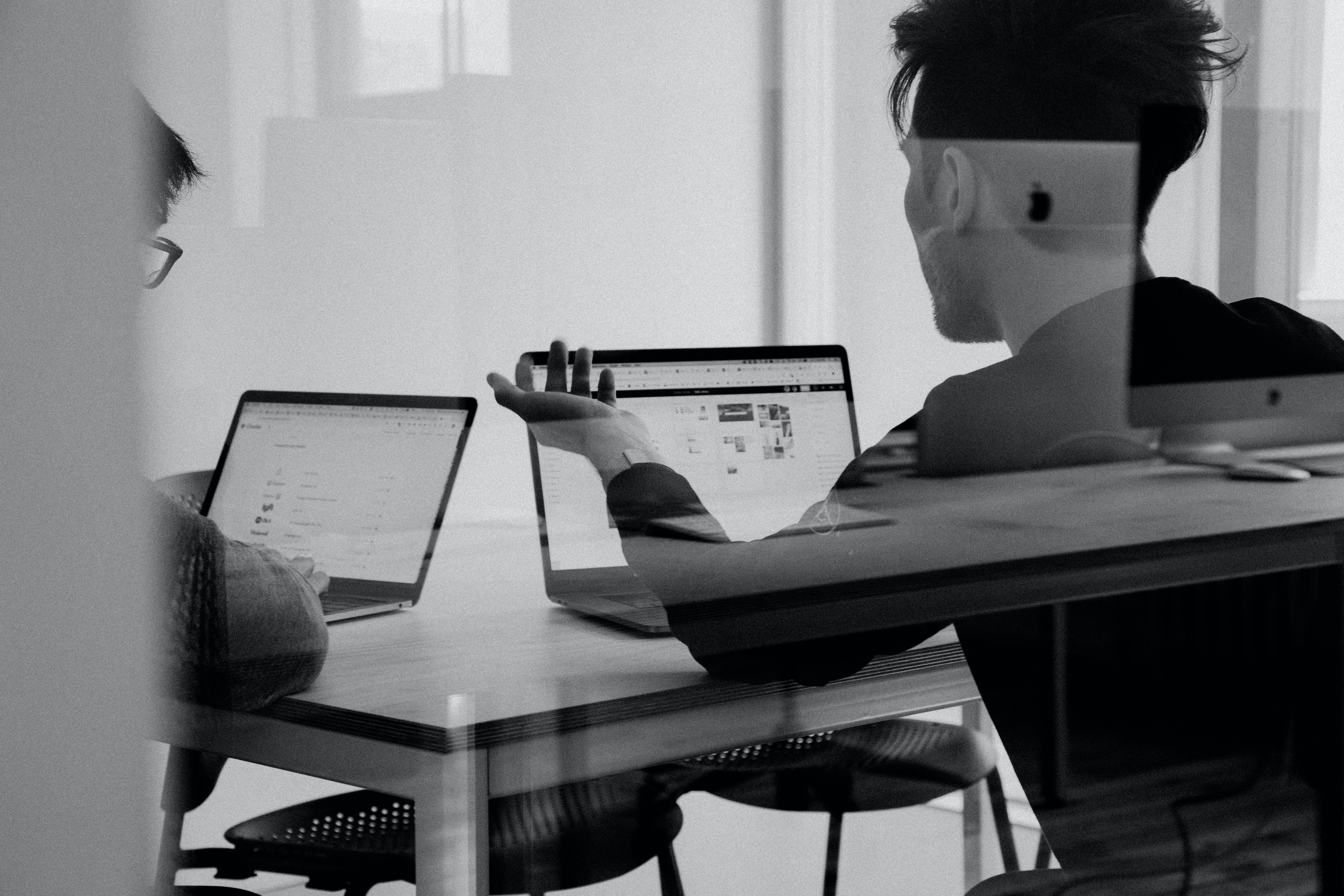 Two people working at a desk